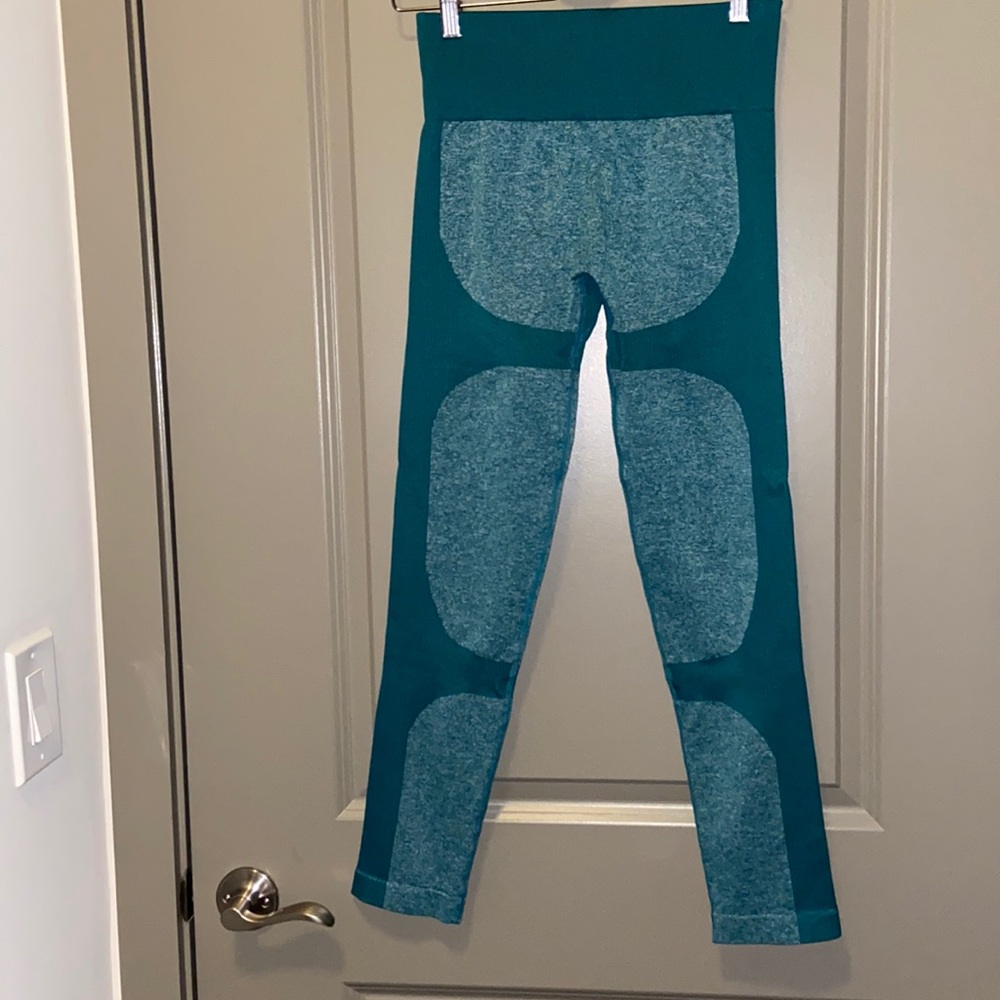 Large body contouring green workout leggings. Great compression band.